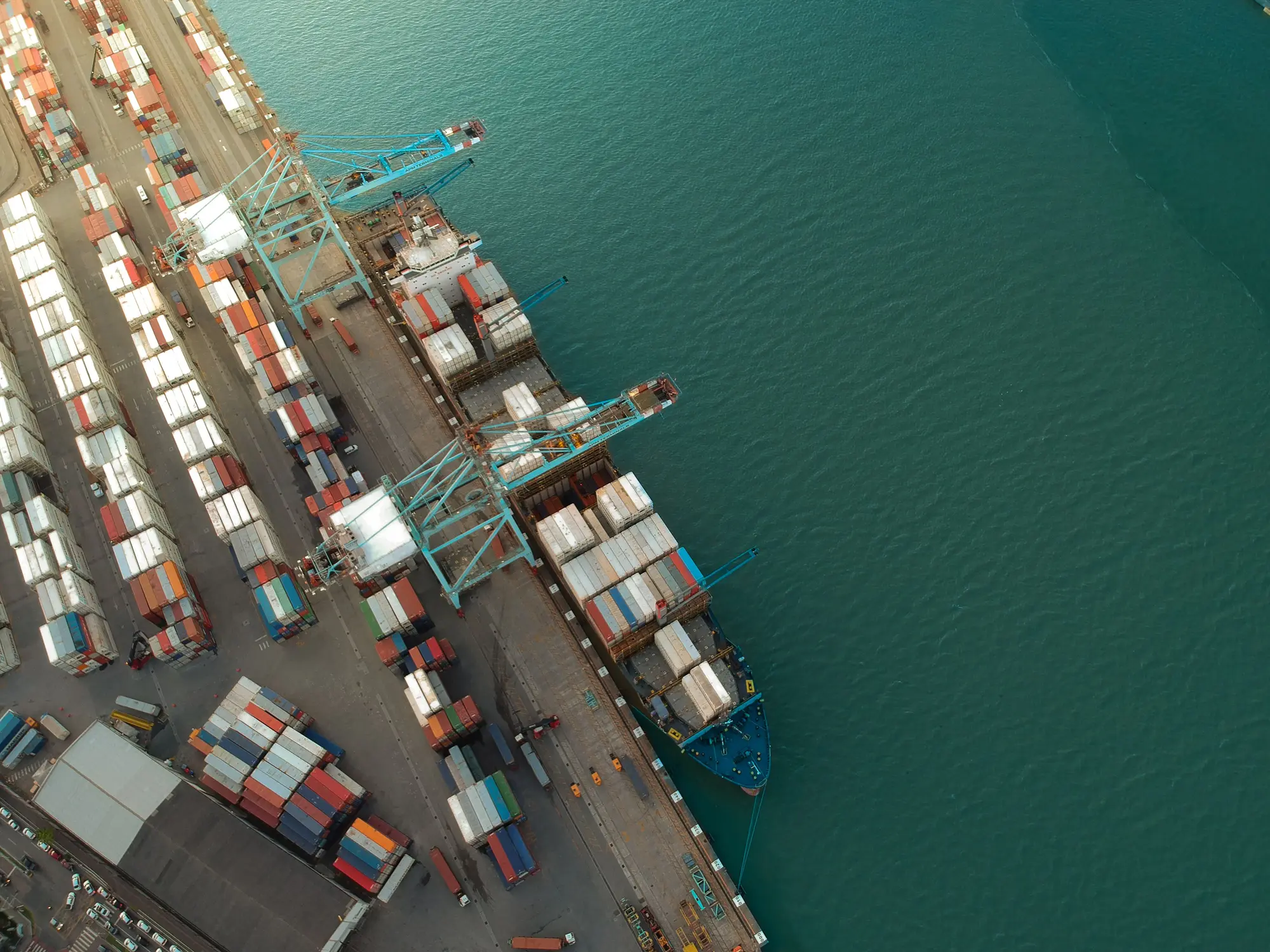 Aerial view of a container port with a ship