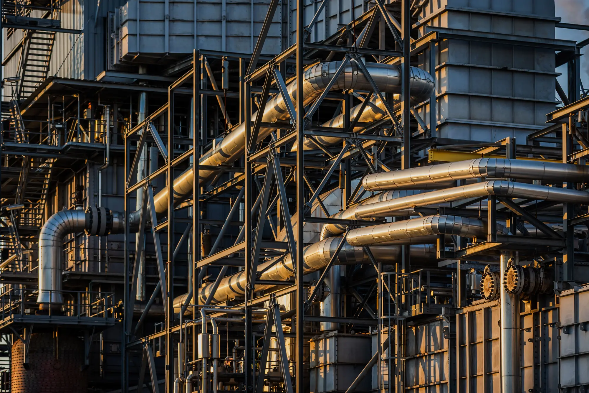 Industrial plant structure with pipework and metal walkways